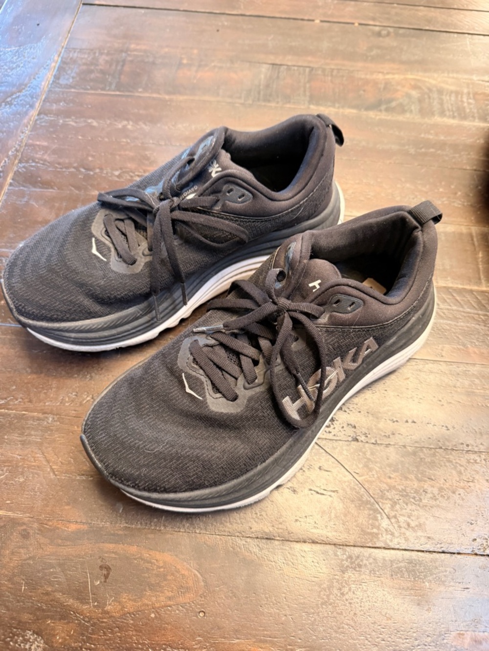 Hoka Woman’s Black Athletic Sneakers with White Midsole